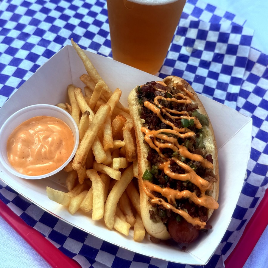 ATX Dog plated with fries and dip